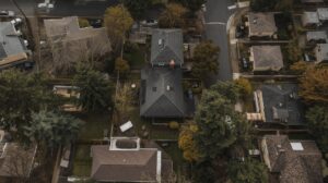 Aerial view of a King County Washington residential neighborhood with mixed roof materials in late spring